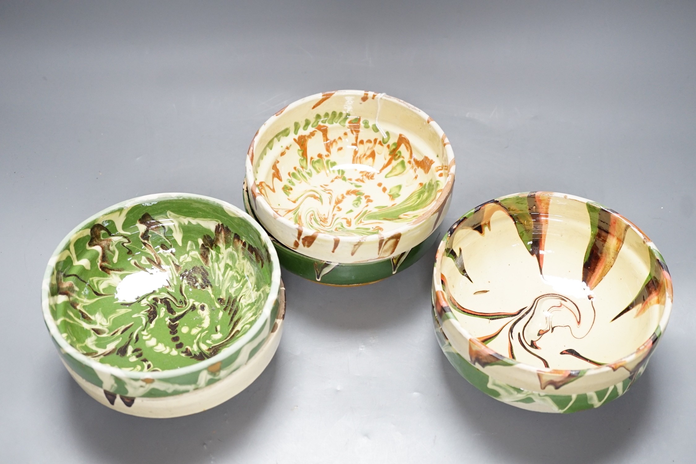 Six pottery spongeware bowls, 16cm diameter